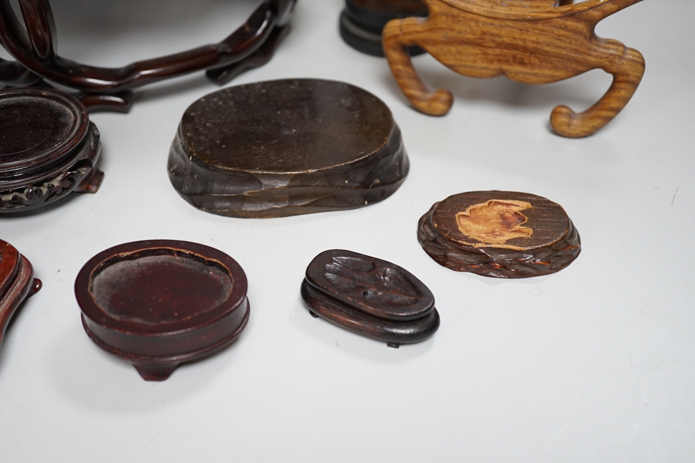 A group of Chinese wood stands and a perfume holder